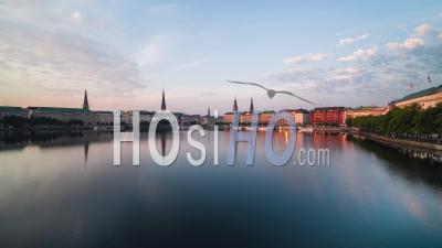 Rise And Push, Yellow And Blue And Red, Sunrise In The City, Establishing Aerial View Shot Of Hamburg De, Mecklenburg-Western Pomerania, Germany - Video Drone Footage