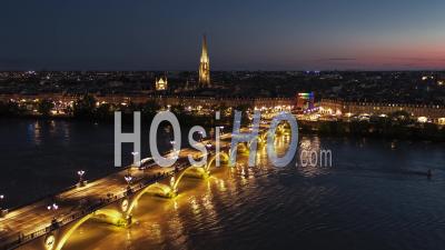 Establishing Aerial View Shot Of Bordeaux Fr, World Capital Of Wine, Nouvelle-Aquitaine, France At Night Evening - Video Drone Footage