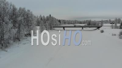 Bridge Over The Frozen River - Video Drone Footage