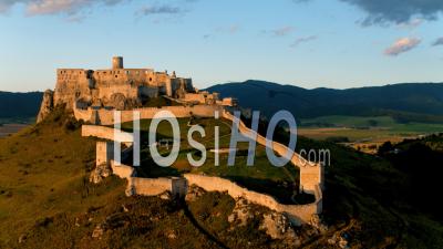 Flying Over Unesco Spis Castle Ruins, Lit By Evening Sun - Video Drone Footage
