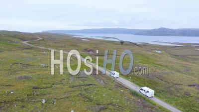Aerial Drone View Of Scotland Highlands Road Trip Driving Holiday In Mountains, With Car On Scottish Roads Of Nc500 (north Coast 500 Route) On An Adventure In Beautiful Scottish Landscape