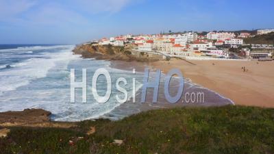 Aerial Drone View Of Sandy Beach At Lisbon, Portugal At Praia Das Macas, A Beautiful Coastal Town On The Atlantic Coast On Top Of A Cliff, A Popular Tourist Destination In Europe