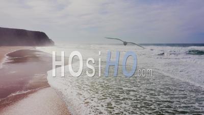 Praia Grande Beach At Sintra, Lisbon, Portugal, On The Atlantic Coast, A Beautiful Sandy Beach With Cliffs In Europe - Video Drone Footage