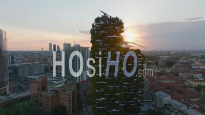 Aerial View Of Ecological Apartment Houses Against Sunset. Tall Buildings With Green Plants On Facade To Improve Interior Conditions. Milano, Italy. - Video Drone Footage