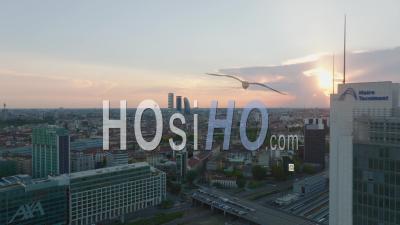 Fly Around Tall Office Buildings. Reveal Of Cityscape With High Rise Towers Silhouette Against Colourful Sunset Sky. Milano, Italy. - Video Drone Footage