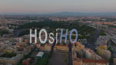 Panoramic Footage Of Large City At Twilight. Aerial View Of Tiburtino Borough With Cemetery. Rome, Italy - Video Drone Footage