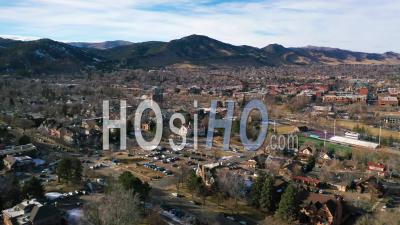 2022 - Aerial Of The City Of Boulder, Colorado And Suburbs With Front Range Of The Rocky Mountains In Background, Winter - Video Drone Footage