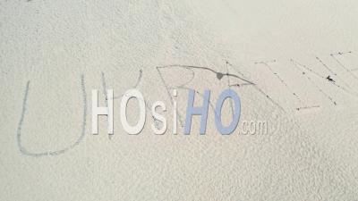2022 - Aerial Of The Word Ukraine Written On Sand Dunes At Pt. Magu Near Malibu, California - Video Drone Footage