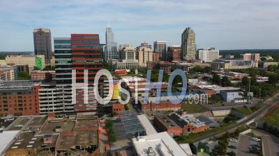 2022 - Good Aerial Of Raleigh North Carolina Downtown Skyline Passing Office Tower - Video Drone Footage