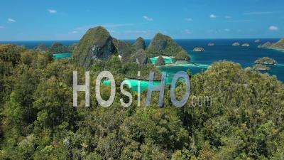 2020 - Excellent Aerial Shot Of Peaks On The Wayag Islands, Raja Ampat, Indonesia - Video Drone Footage