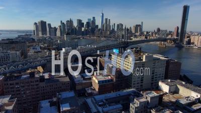Very Good Aerial Of Dumbo Brooklyn With Manhattan And Brooklyn Bridge And New York City Skyline In Distance - Video Drone Footage