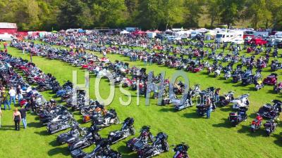 Good Aerial Over Bikers At A Huge Biker Rally In Ohio And Parking Motorcycles In Large Field - Video Drone Footage