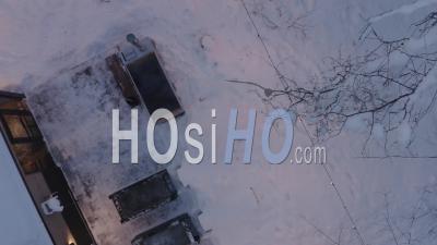 Cozy Sauna And Hot Tub In Wintery Forest, Viewed By Drone