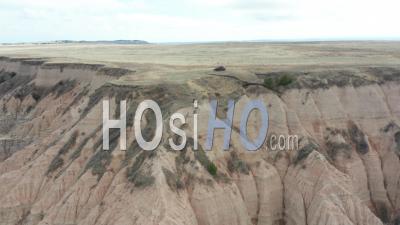 Person And Car On Edge Of Canyon, The Badlands, South Dakota, Usa - Video Drone Footage