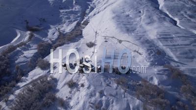Le Clot Raffin, A Small Mountain Village Near Le Chazelet, In The Hautes-Alpes In Winter, Viewed From Drone