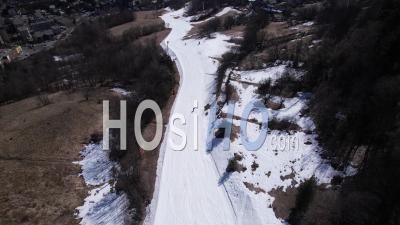 Artificial Snow Ski Slope Near The Town Of Briançon (serre Chevalier Resort), Hautes-Alpes, France, Viewed From Drone
