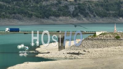 The Serre-Poncon Lake And The Savines-Le-Lac Bridge, Hautes-Alpes, France - Video Drone Footage