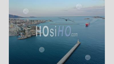 Marseille, Euromediterranean Area, Seawall, Arrival Of A Cargo Ship Corsica Ferry In The Large Maritime Port Of Marseille From Sainte Marie Lighthouse, Bouches-Du-Rhone, France - Aerial Photography