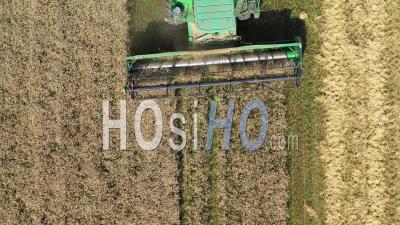 Harvester In Field - Video Drone Footage