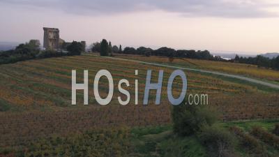 The Chateauneuf-Du-Pape Vineyard In Autumn And The Chateau Of L'hers, Chateauneuf-Du-Pape, Vaucluse, France - Video Drone Footage