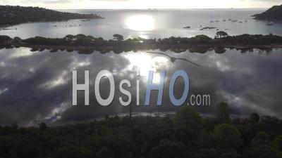 Aerial View Of Clouds Mirror At Santa Giulia Bay In Corsica, France - Video Drone Footage