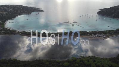 Aerial View Of Clouds Mirror At Santa Giulia Bay In Corsica, France - Video Drone Footage