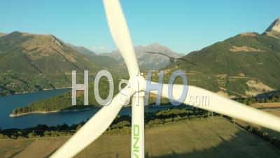 Wind Turbine Next To The Sautet Dam At Golden Hour, France, Drone Point Of View