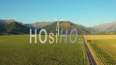 Wind Turbine Next To The Sautet Dam At Golden Hour, France, Drone Point Of View