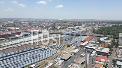Raamfontein Train Yard, Newtown And Johannesburg City Centre, With Traffic On The M1 Motorway And Nelson Mandela Bridge In Johannesburg, South Africa - Video Drone Footage