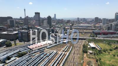 Looking East Over Braamfontein Train Yard With Braamfontein And Hillbrow In The Background In Summer - Video Drone Footage