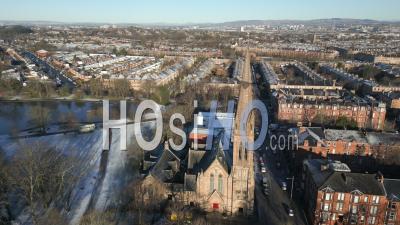 Queens Park Baptist Church During A Winter Morning With Tenement Housing In The Background - Video Drone Footage