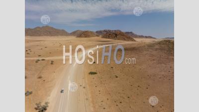 Four-Wheel Drive 4wd Car On Desert Road D1273 Nearby Solitaire, Namibia - Aerial Photography