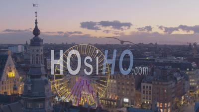 Christmas Wheel And Beffroi In Grand Place Of Lille At Sunset - Video Drone Footage