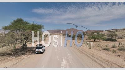 Four-Wheel Drive 4wd Car On Desert Road D1273 Nearby Solitaire, Namibia - Video Drone Footage