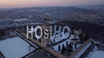 Sunset Over Cetatuia Monastery Of Lasi By Winter - Video Drone Footage