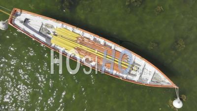 The Red Rowboat In The Port Of Kerity Ready For The Next Trip - Video Drone Footage