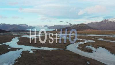 Lake And River Along South Coast Of Iceland, In Winter - Video Drone Footage