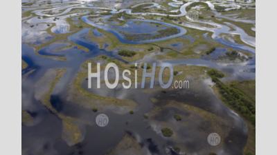 Aerial View Of Winding Flooded River Beds With Ducts, During The Spring Flood. Drone View.