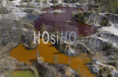 Lake With Yellow Polluted Toxic Water In Abandoned Open Pit Mine. - Aerial Photography