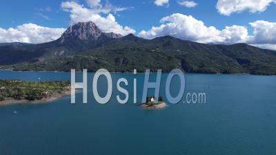 The Saint-Michel Chapel And Its Islet On Lake Serre Poncon - Video Drone Footage