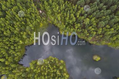 Small Forest Lake With Blue Water. Aerial View. Shot From Drone.