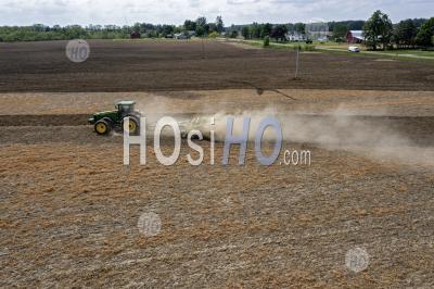 Dust Blows As Farmer Tills Field - Aerial Photography