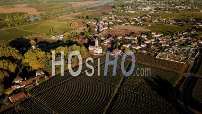 Aerial View Of Rions Village, Fortified City, In Bordeaux Vineyard , Rions, Gironde, France - Video Drone Footage